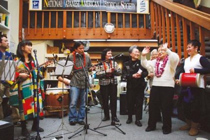 "Nuchi du Takara" exhibit opening day, with performers playing instruments.
