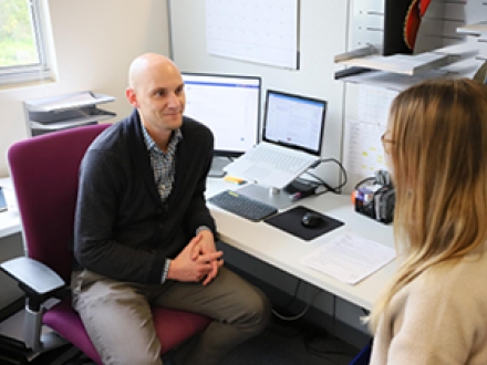 professional advisor talking with a student